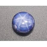 A spectacular, blue STAR SAPPHIRE. Good size (10.50 carats), round cabochon (diameter: 13 mm). Due