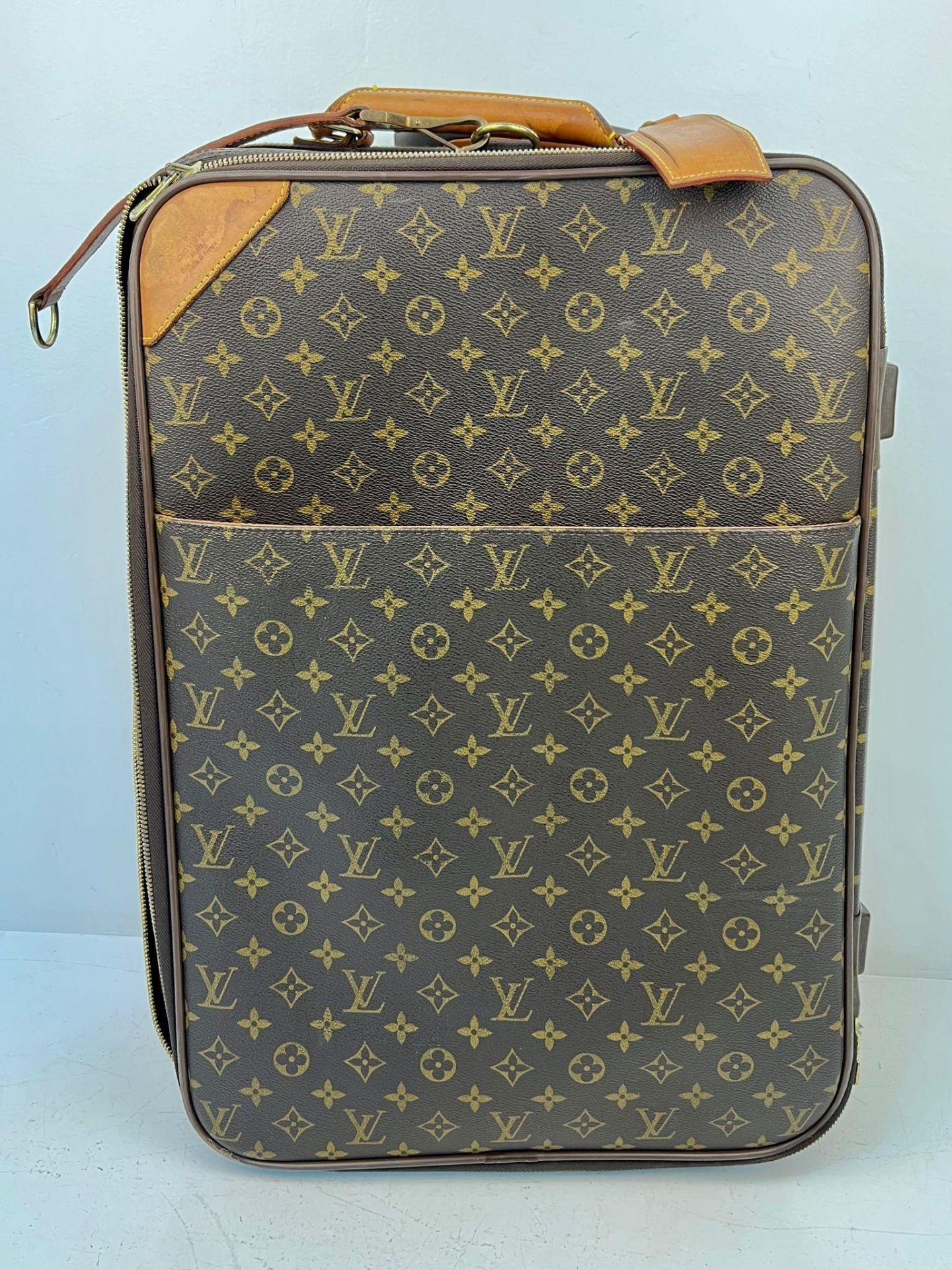 A Louis Vuitton Pegase Trolley Cabin Suitcase. Monogram LV canvas exterior with large open pocket.