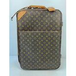 A Louis Vuitton Pegase Trolley Cabin Suitcase. Monogram LV canvas exterior with large open pocket.