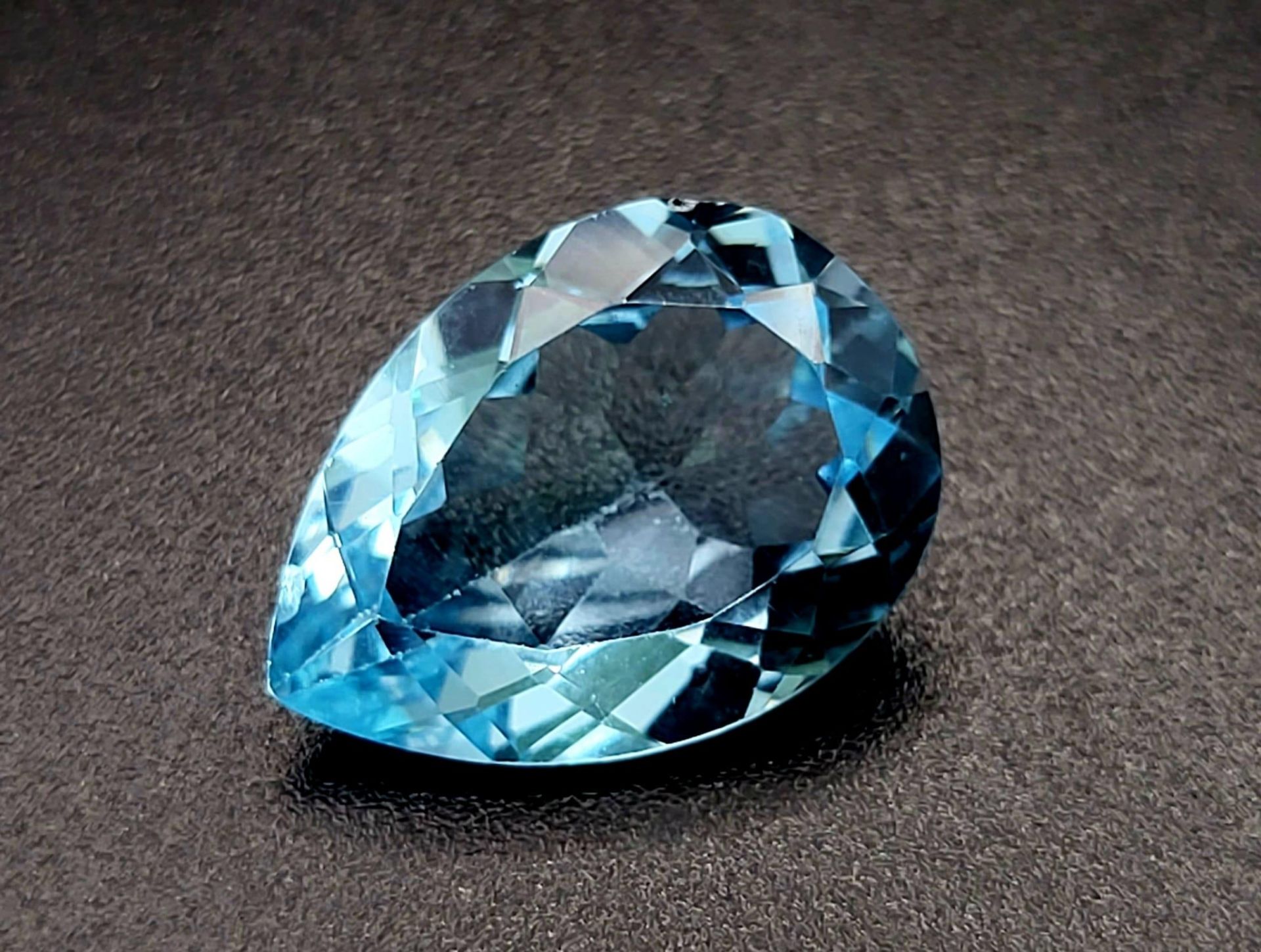 An 11.40ct Natural Blue Topaz Gemstone. GFCO Swiss Certification Included.