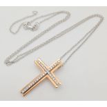 A 9K Rose Gold and Diamond Cross Pendant on a 9K White Gold Disappearing Necklace. Diamond encrusted