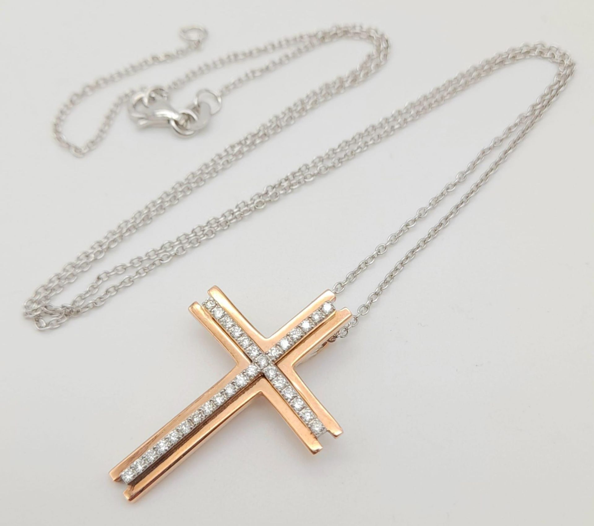 A 9K Rose Gold and Diamond Cross Pendant on a 9K White Gold Disappearing Necklace. Diamond encrusted