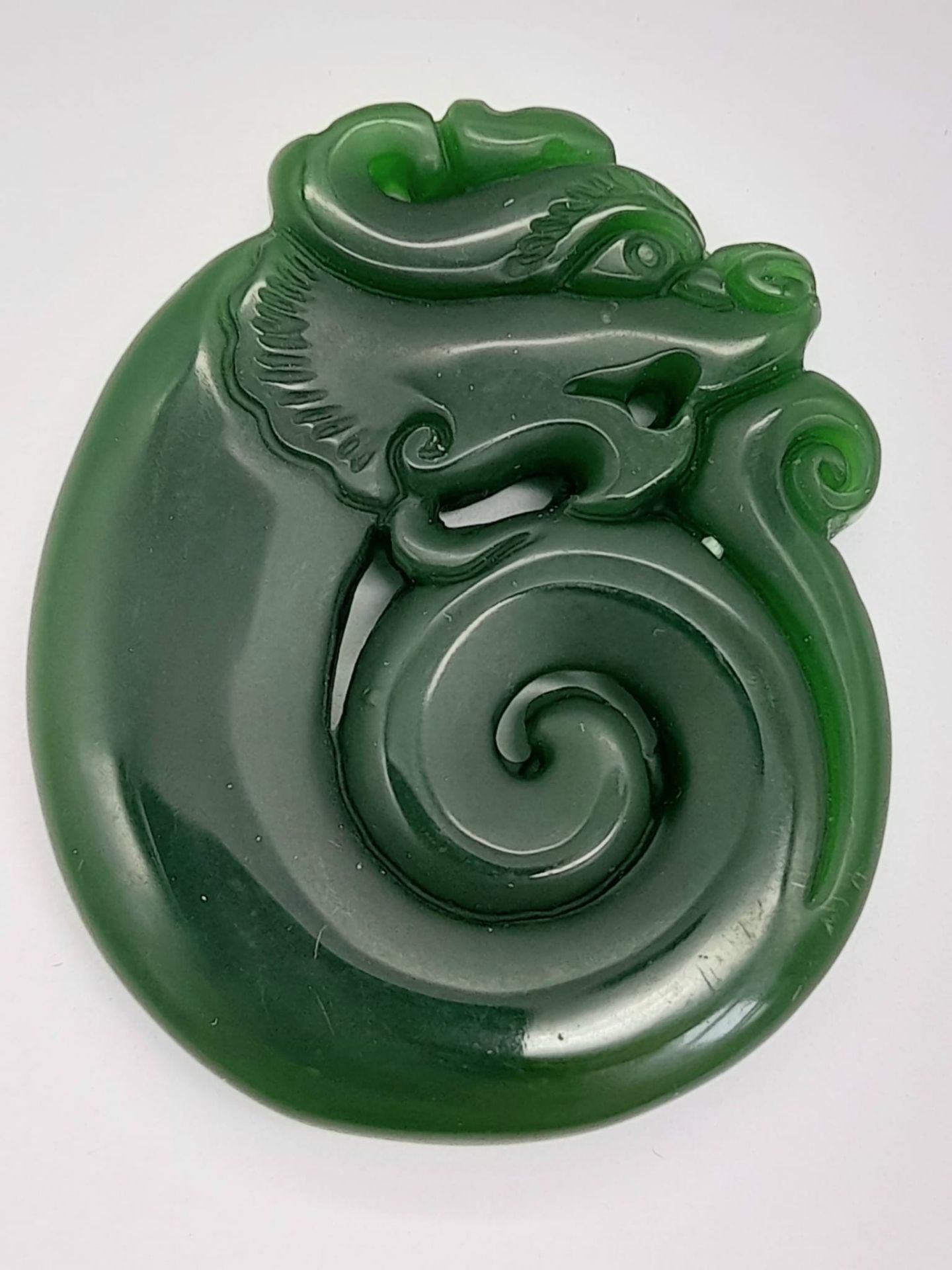 A Chinese Green Jade Dragon Pendant. 4.5cm