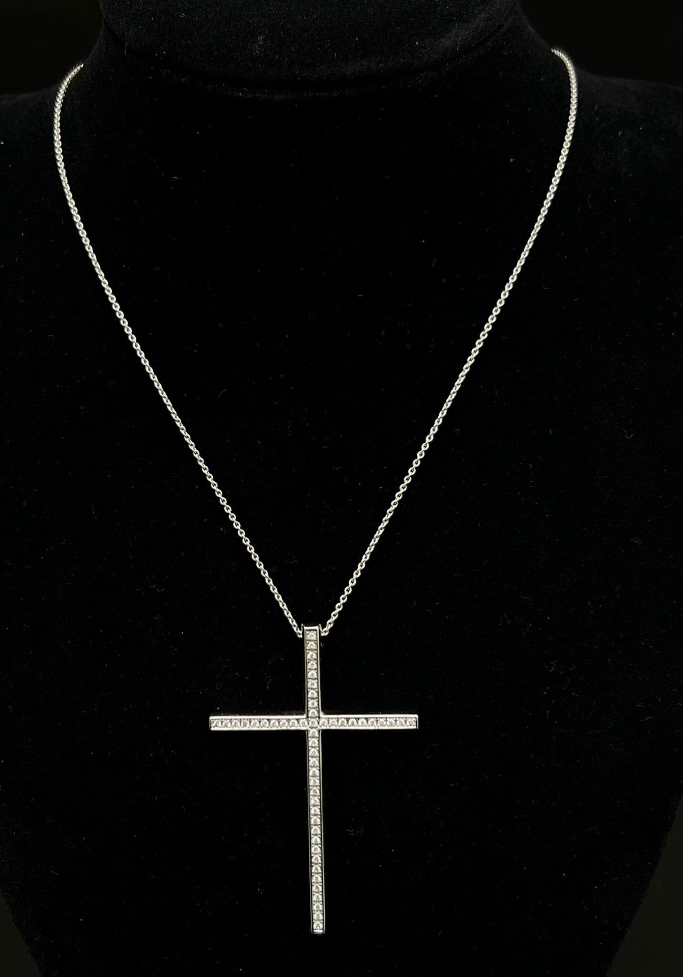 An 18K White Gold Diamond Cross Pendant on an 18K White Gold Necklace. 2ctw diamonds approx. 10.
