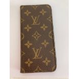 Genuine LOUIS VUITTON folio phone case for iPhone 7 or similar. Finished in brown leather with the