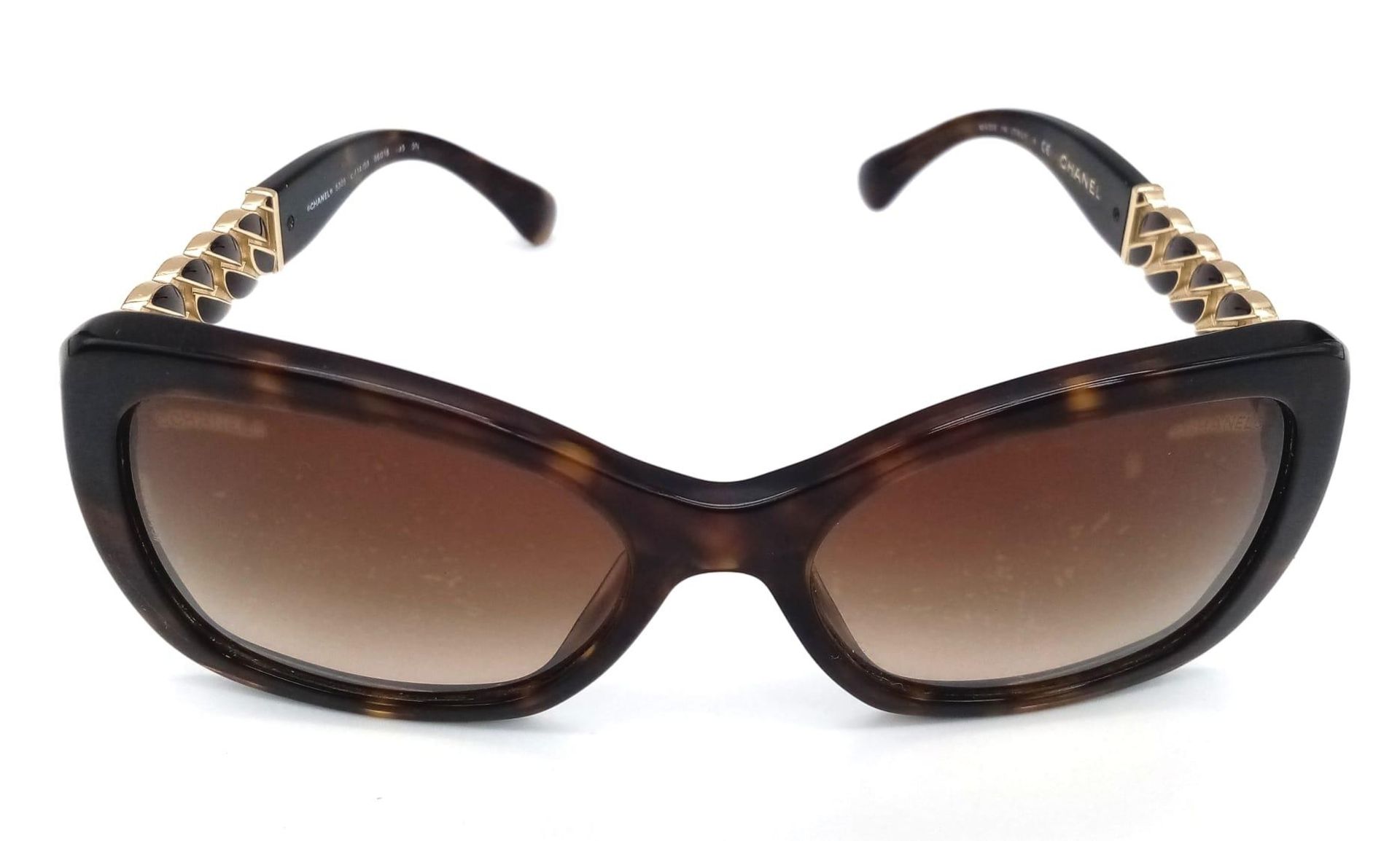 A Pair of Ladies Chanel Sunglasses with Case. Glasses are fine - case is worn. Ref: 12753