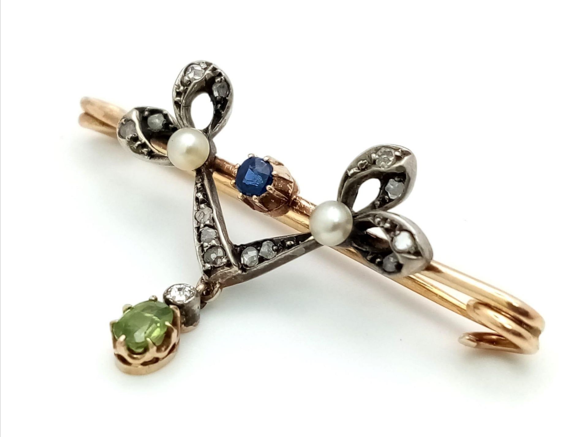 A Superb Double Bow Sapphire Diamond and Pearl Brooch with a Demontoid Garnet and Diamond Drop set