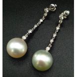 A FABULOUS PAIR OF NATURAL PEARL AND DIAMOND DROP EARRINGS . 8.7gms 4cms drop.