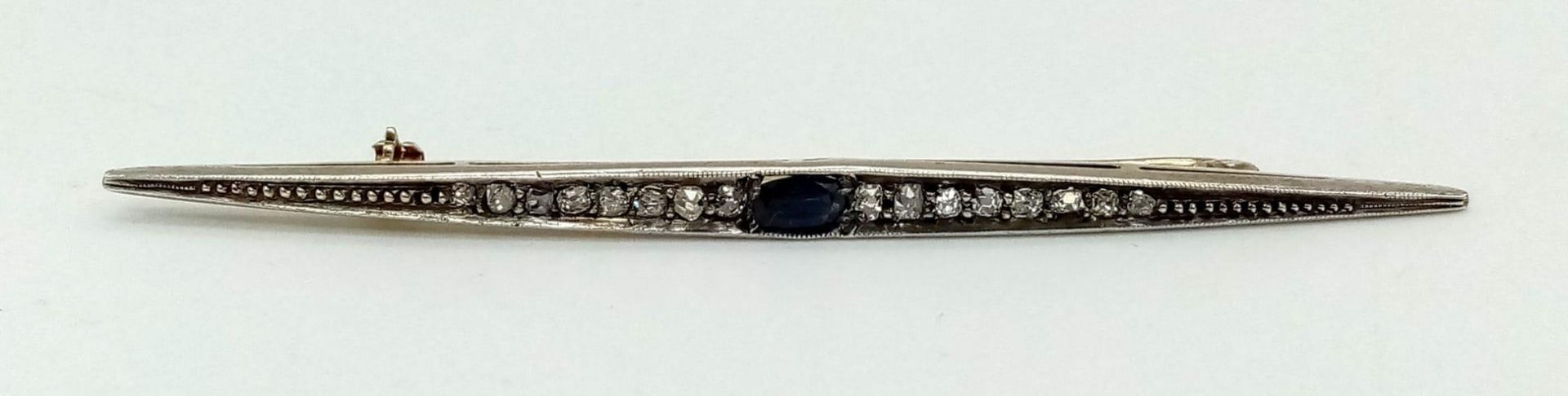 An antique yellow and white gold brooch with old cut diamonds and a blue sapphire. Length: 80 mm. In - Image 3 of 4