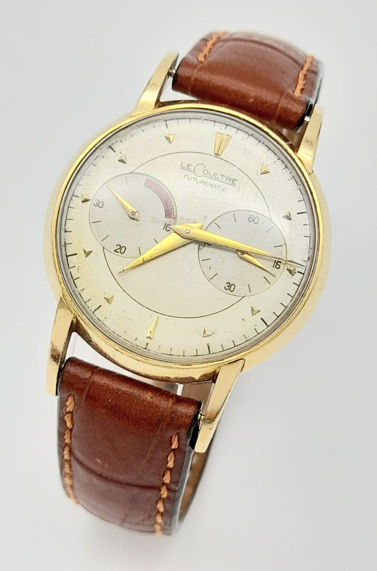 A Vintage Jaeger Le Coultre Futurematic Gents Watch.Brown leather strap. Case - 35mm. White dial