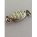 Vintage Rare and unusual SILVER PILL BOX in the form of a wrapped toffee. Having full UK hallmark.