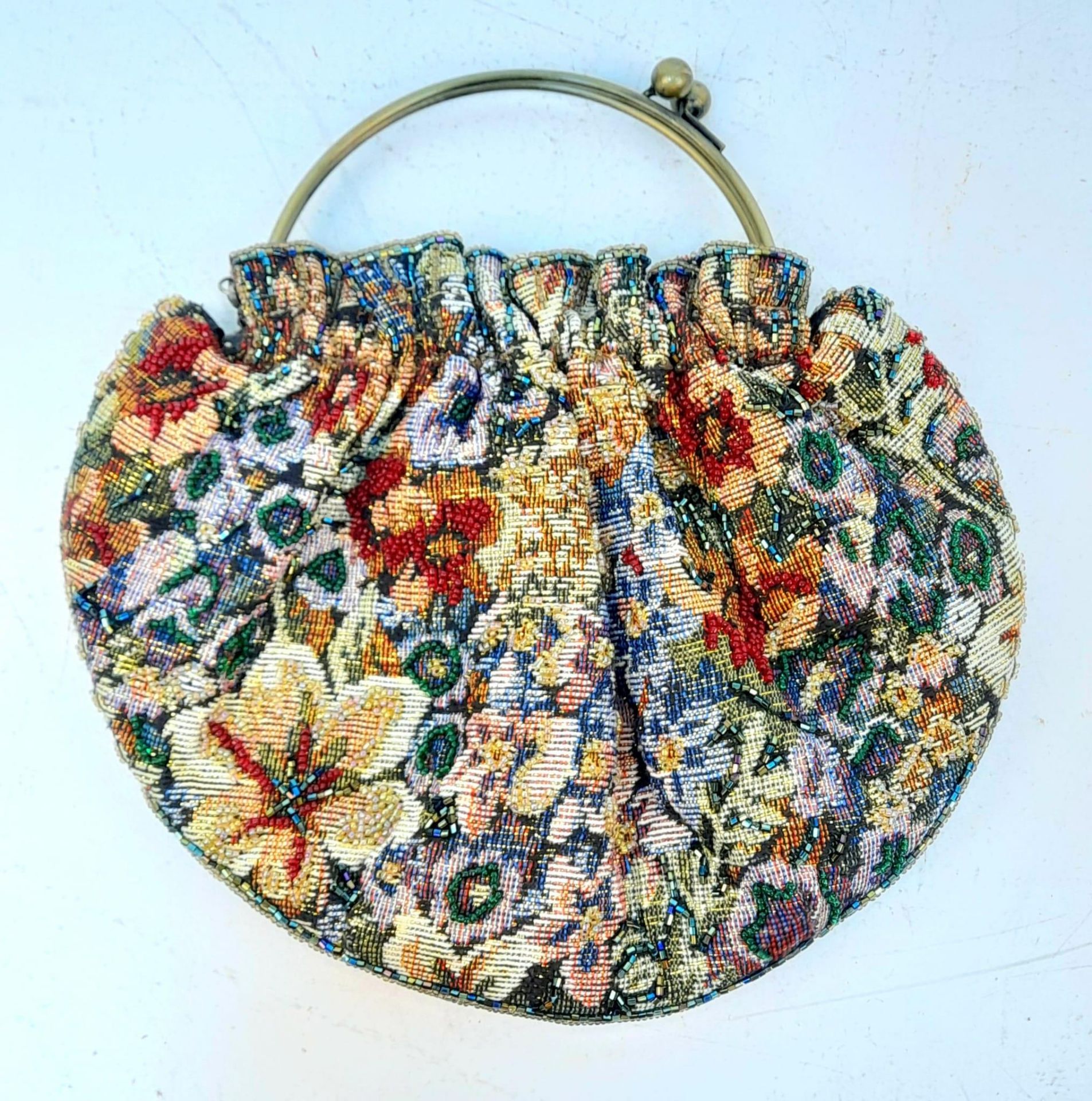 A Multi-Colour Textile and Beaded Handbag. Ball-snap clasp handle. Metal shoulder strap. 26cm x