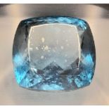 An Impressve 101.16ct Blue Topaz Cushion-Cut Gemstone. Eye-Clean. AIG Milan Certified. Swiss Blue
