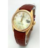 A Rolex Perpetual Oyster 18K Gold Cased Datejust Ladies Watch. Brown leather strap. 18K gold