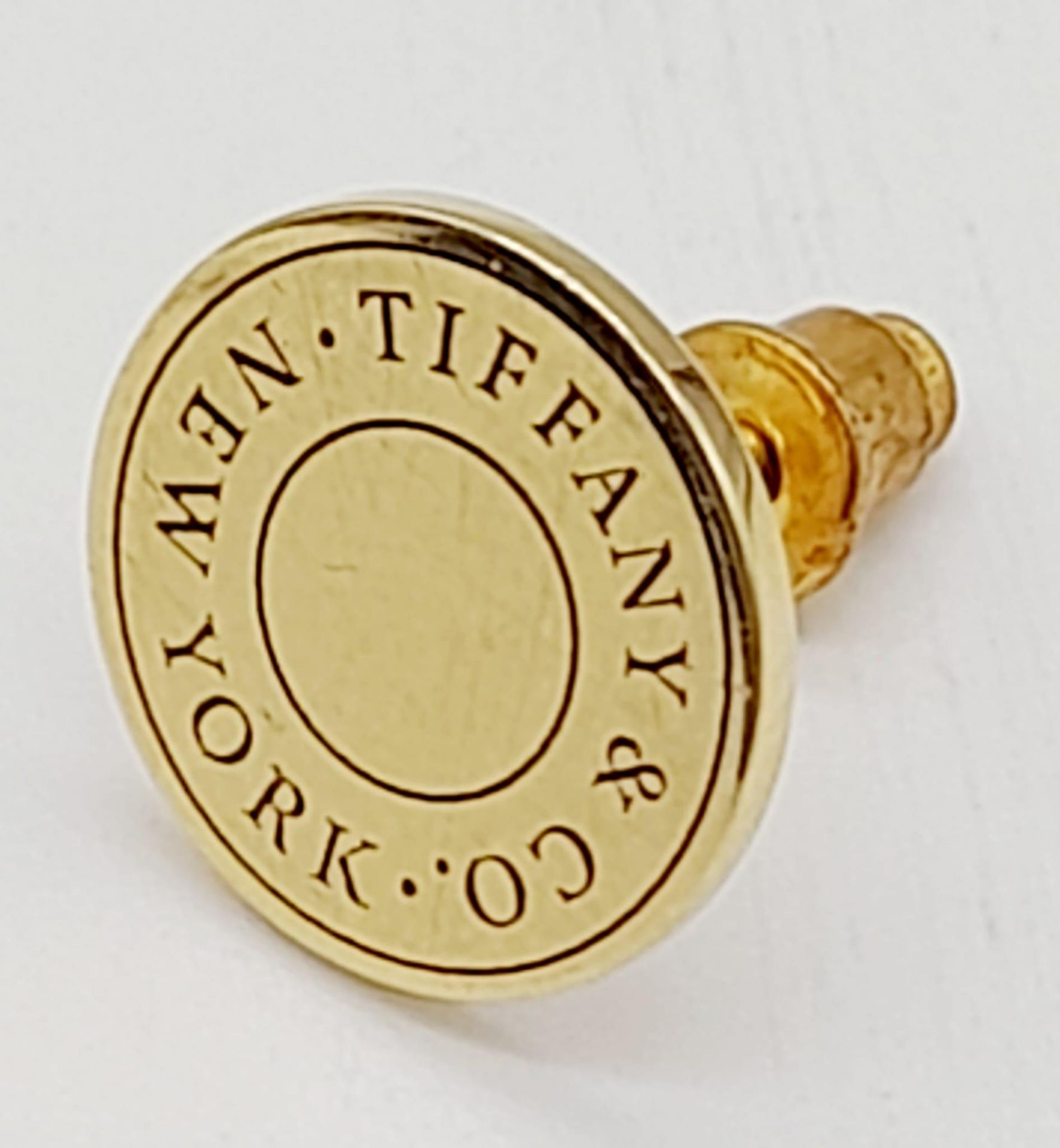 An 18K Yellow Gold Tiffany and Co. Tie Pin. 2.55g