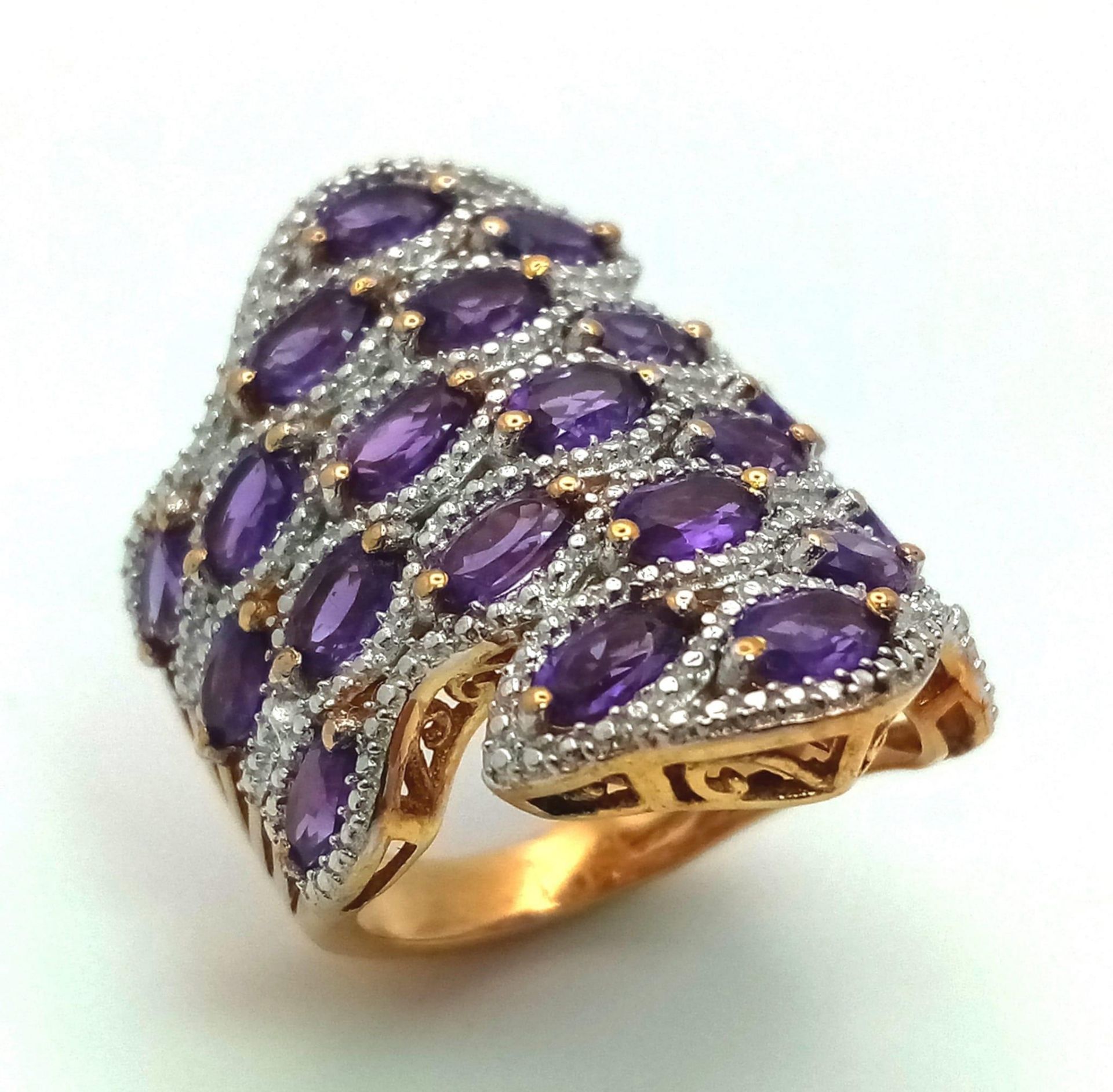 A Very Good Condition Sterling Silver Gilt and Amethyst Art Deco Style Ring Size Q. The Crown