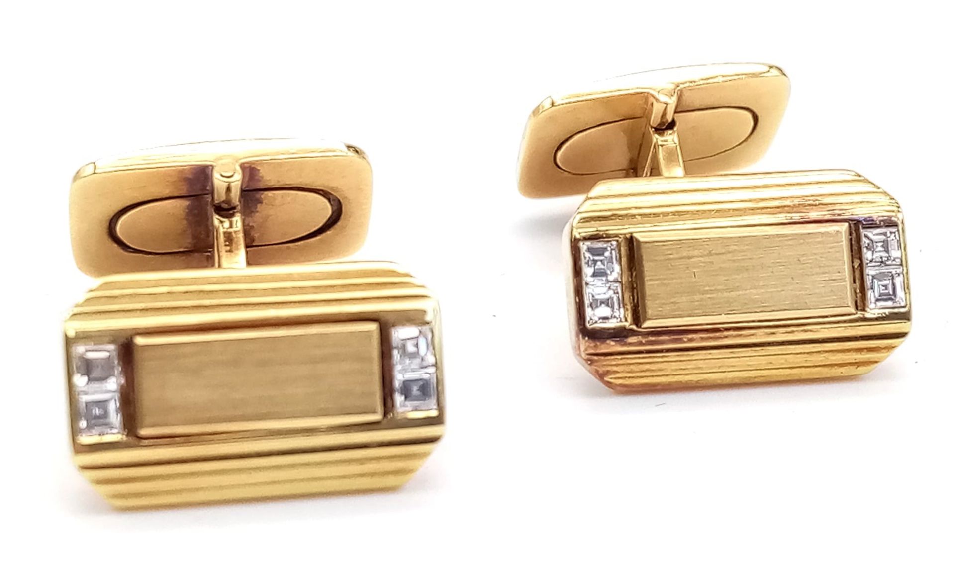 A Pair of 18K Yellow Gold and Diamond Gents Cufflinks. Art deco style each with four Princess cut