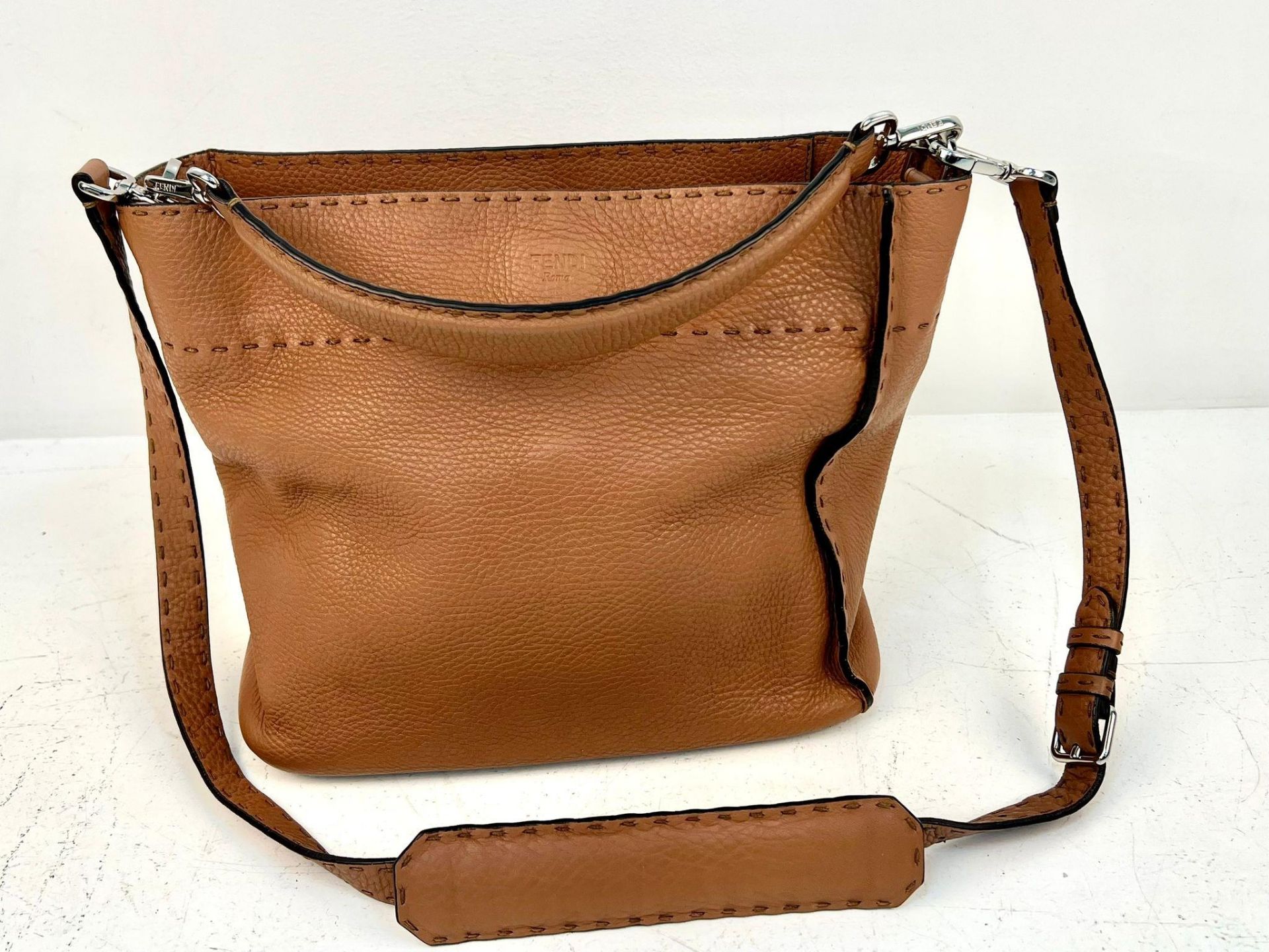 A Fendi Brown Leather Anna Shoulder Bag. Choice of central handle or shoulder strap. Soft brown