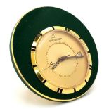 A Vintage Jaeger le Coultre Travel Alarm Clock. Green enamel outer. Gilded dial with date window.