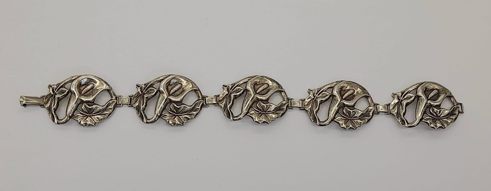 A romantic Art Nouveau sterling silver bracelet with Arum lilies (or calla lilies as they are most