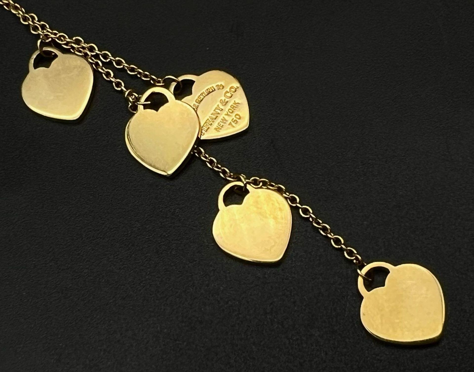 A Tiffany and Co 18K Yellow Gold Five-Heart Necklace. 40cm - necklace. 8cm - hearts attachment. - Image 2 of 4