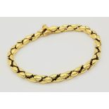 An 18K Yellow Gold Reptilian Link Bracelet. Sapphire decorated clasp. 20cm. 19.05g. Ref: 12812