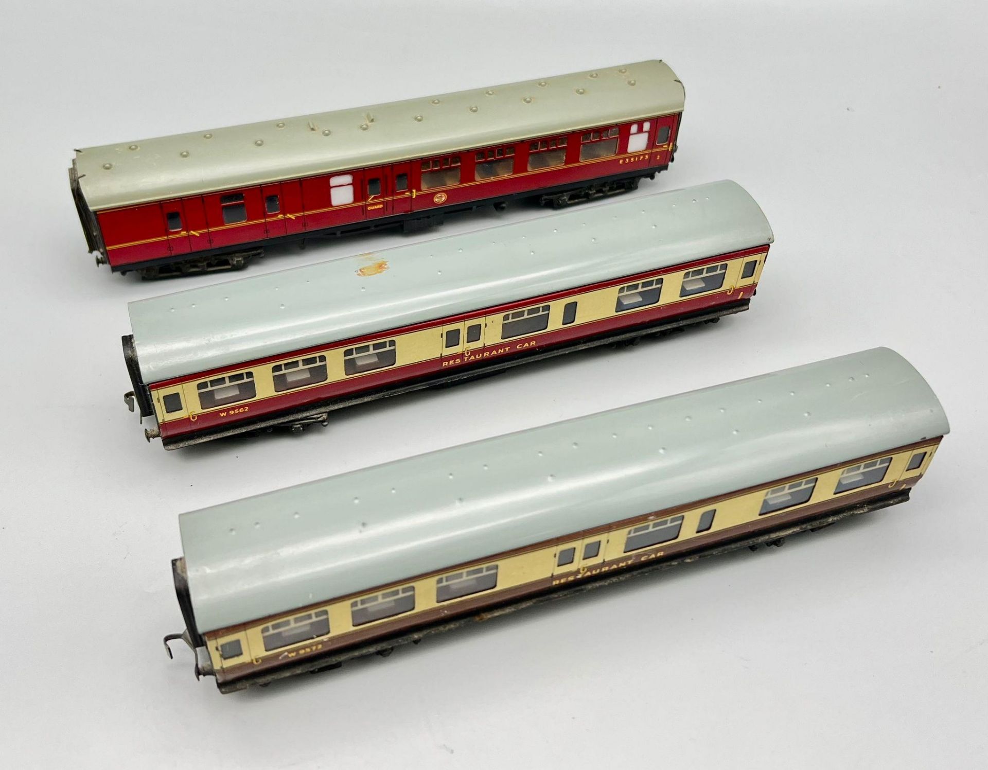 Three Vintage Hornby Dublo Model Train Cars. Two restaurant (21cm) and one guard car (24cm). In good