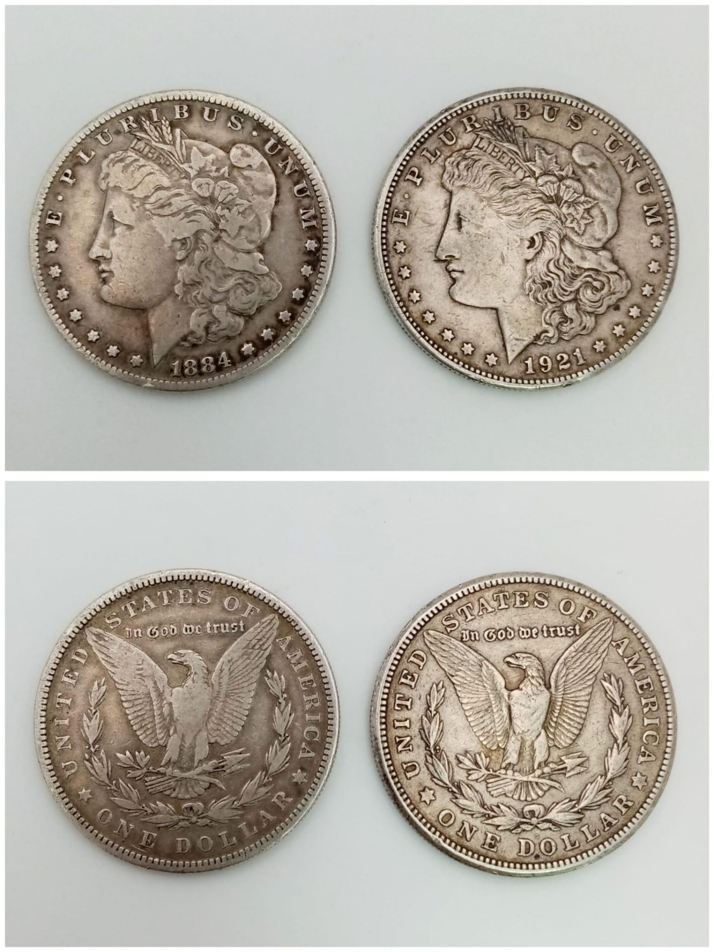 Two Silver USA Morgan Dollars - 1884 and 1921 - S. Please see photos for conditions.