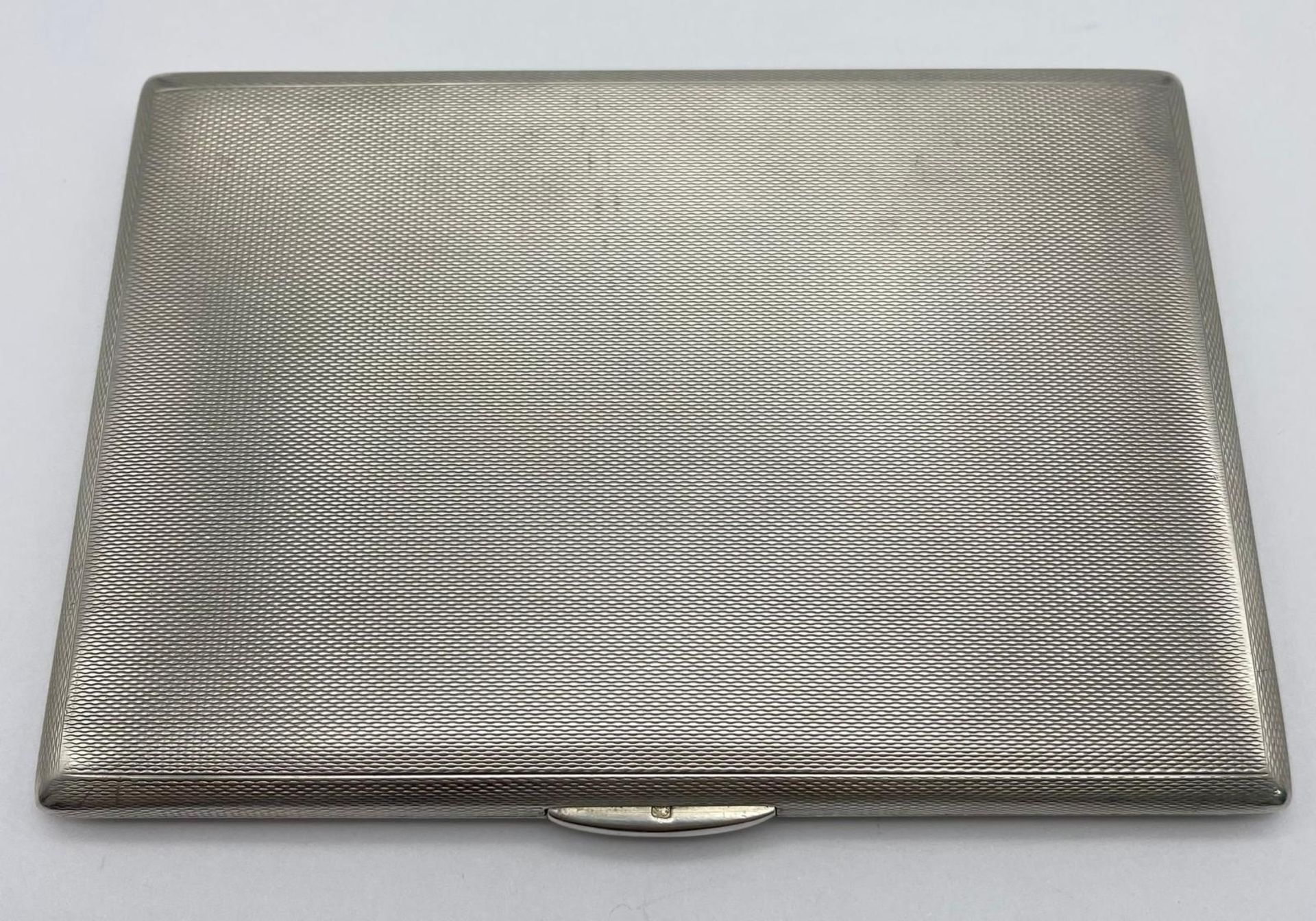 A Silver Cigarette Case. Weighs 200g. 12.5cm x 8.5cm.