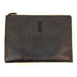 An Yves Saint Laurent (YSL) Black Leather Pouch. Initials on exterior. Cloth interior with