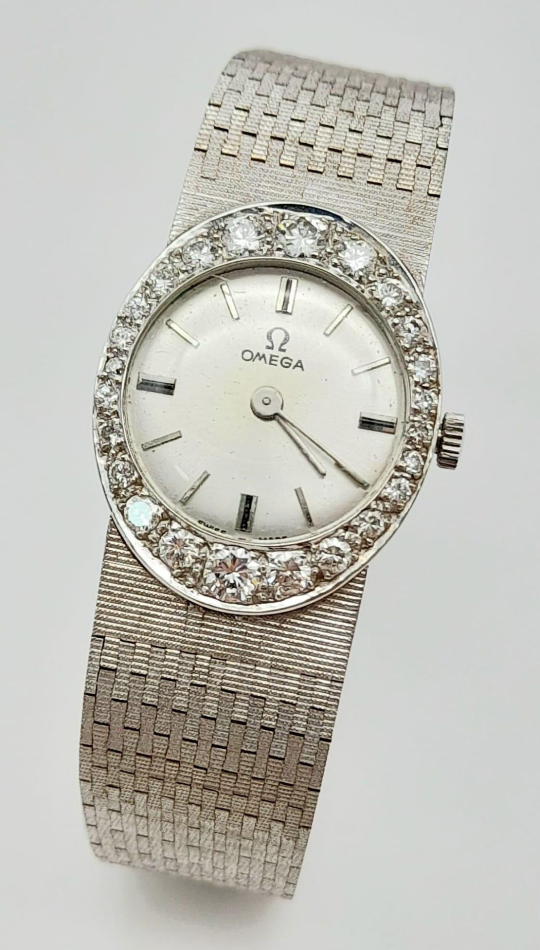 A Vintage 18K White Gold and Diamond Omega Ladies Watch. 18k gold bracelet and oval case - 21mm.