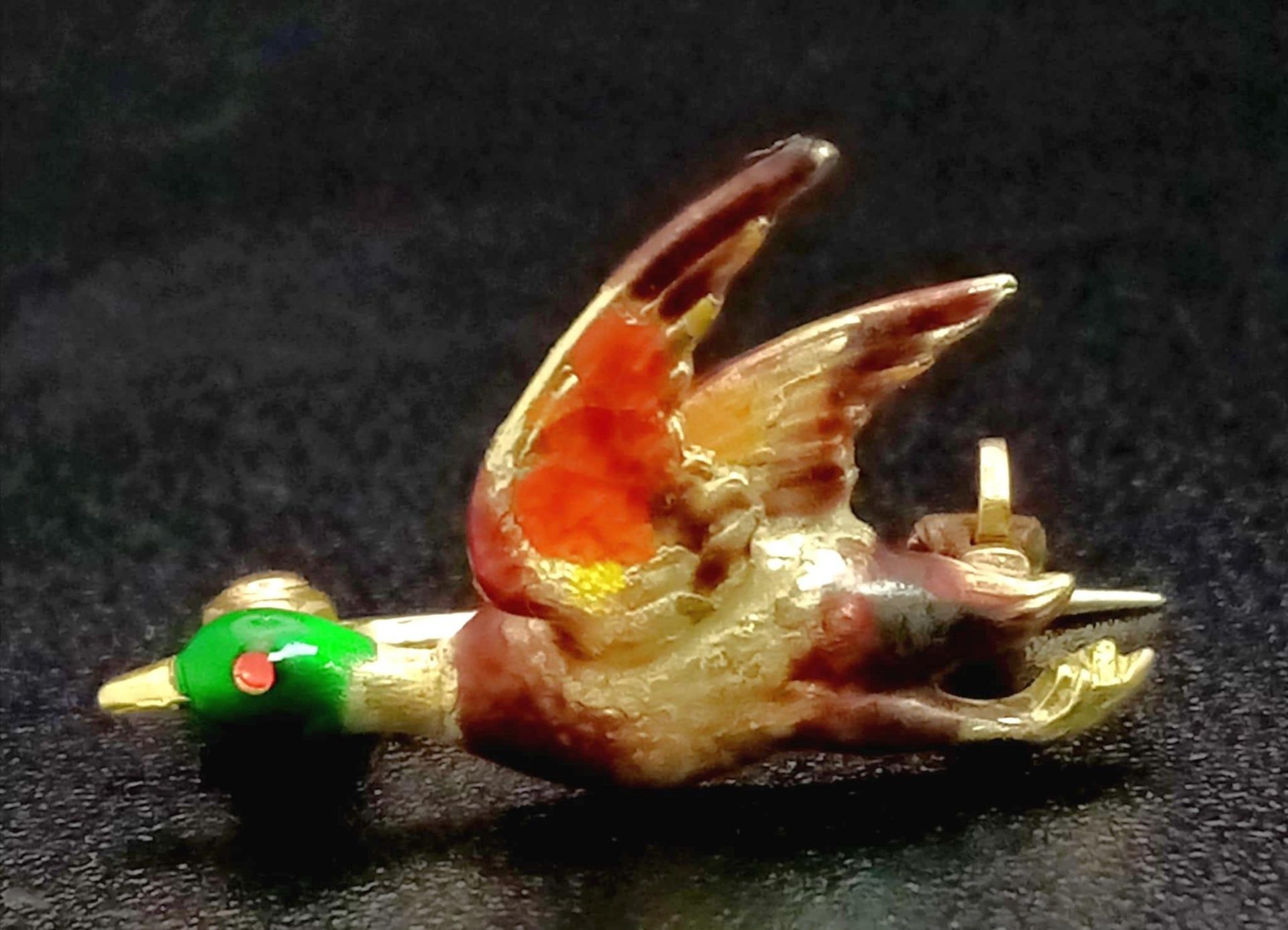 An Antique Fully Detailed Enamelled Pheasant in Full Flight Brooch. Set in high-karat gold (tested).