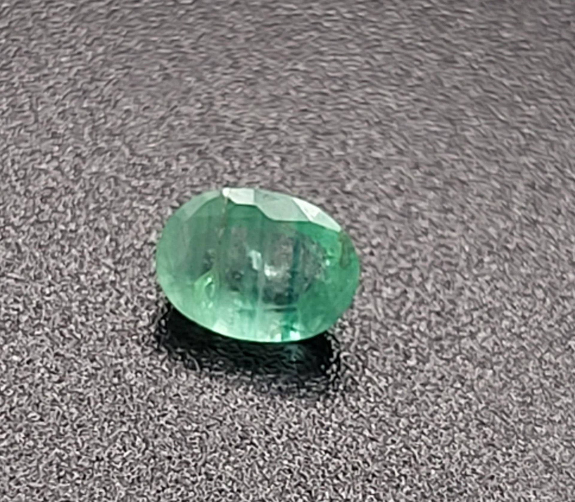 A 0.56ct Zambian Emerald. Swiss Origin Certification Included.