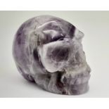 A Hand-Carved Amethyst Skull Figure. 5cm x 4cm