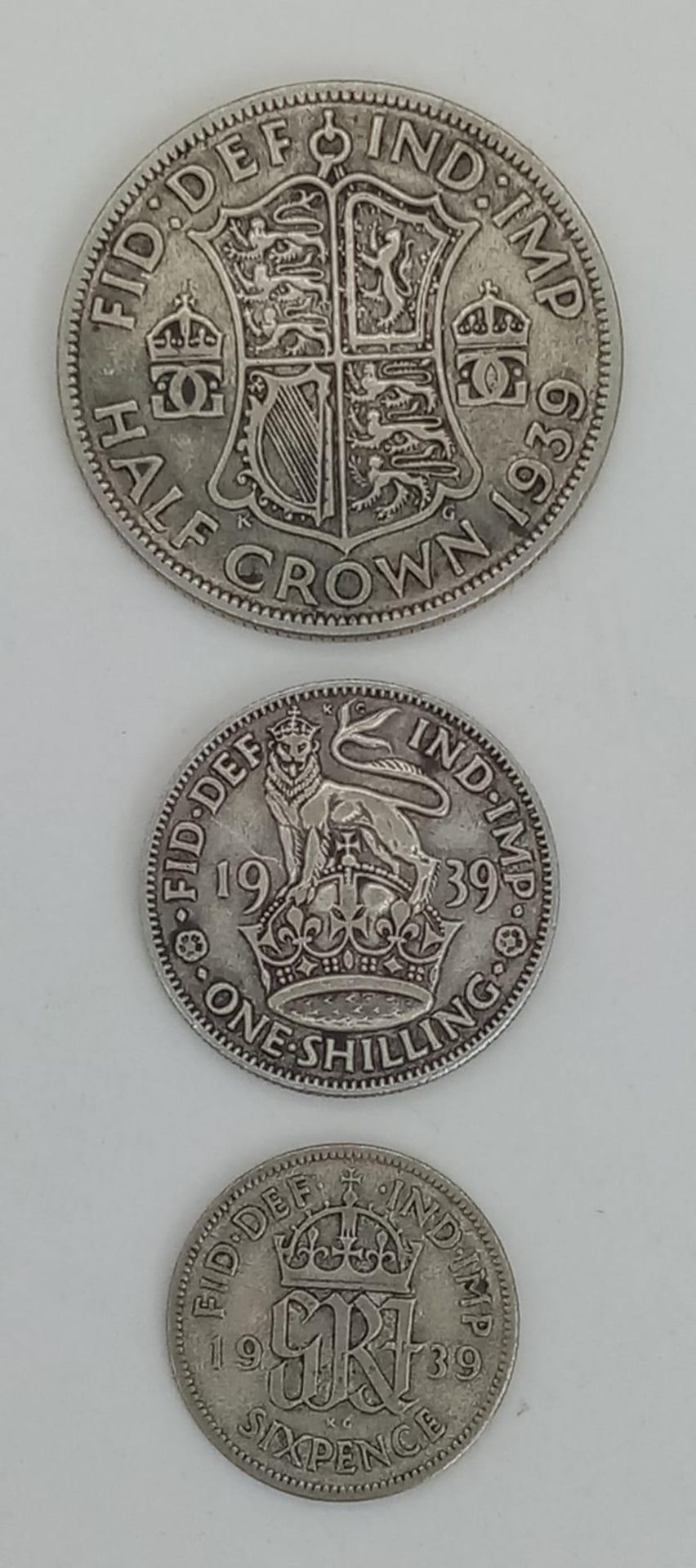 A Parcel of Three 1939 Dated British Silver Coins Comprising; 1 x Half Crown, 1 x One Shilling and 1