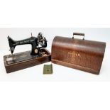 An Antique Handcrank Singer Sewing Machine Model 99k with Original Case and instructions. Due to