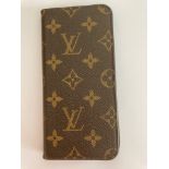 Genuine LOUIS VUITTON FOLIO phone case. Suitable for iPhone 7 or similar. Having the iconic LV