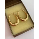 Pair of large 14 carat GOLD CREOLE HOOP EARRINGS. Finished in contrasting smooth and textured