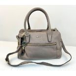A DKNY Brown Leather Handbag with Shoulder Strap. Gold-tone hardware. Exterior zipped compartment.