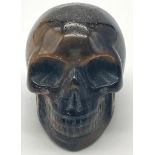 A Hand-Carved Tigers Eye Skull Figure. 5 x 4cm