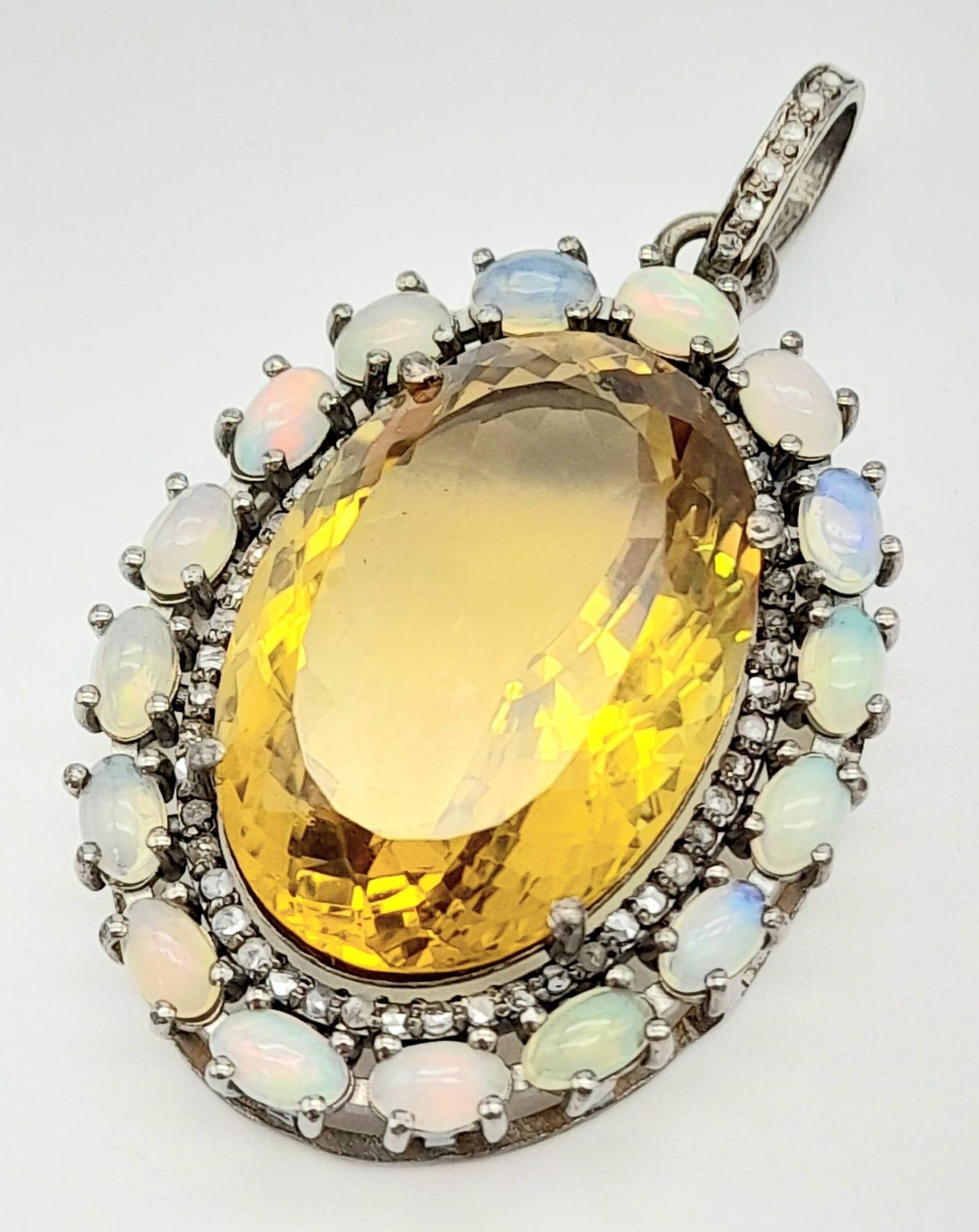 A Citrine, Opal and Diamond Pendant set in 925 Sterling Silver. 29.95ct of gems and 0.60ct diamond