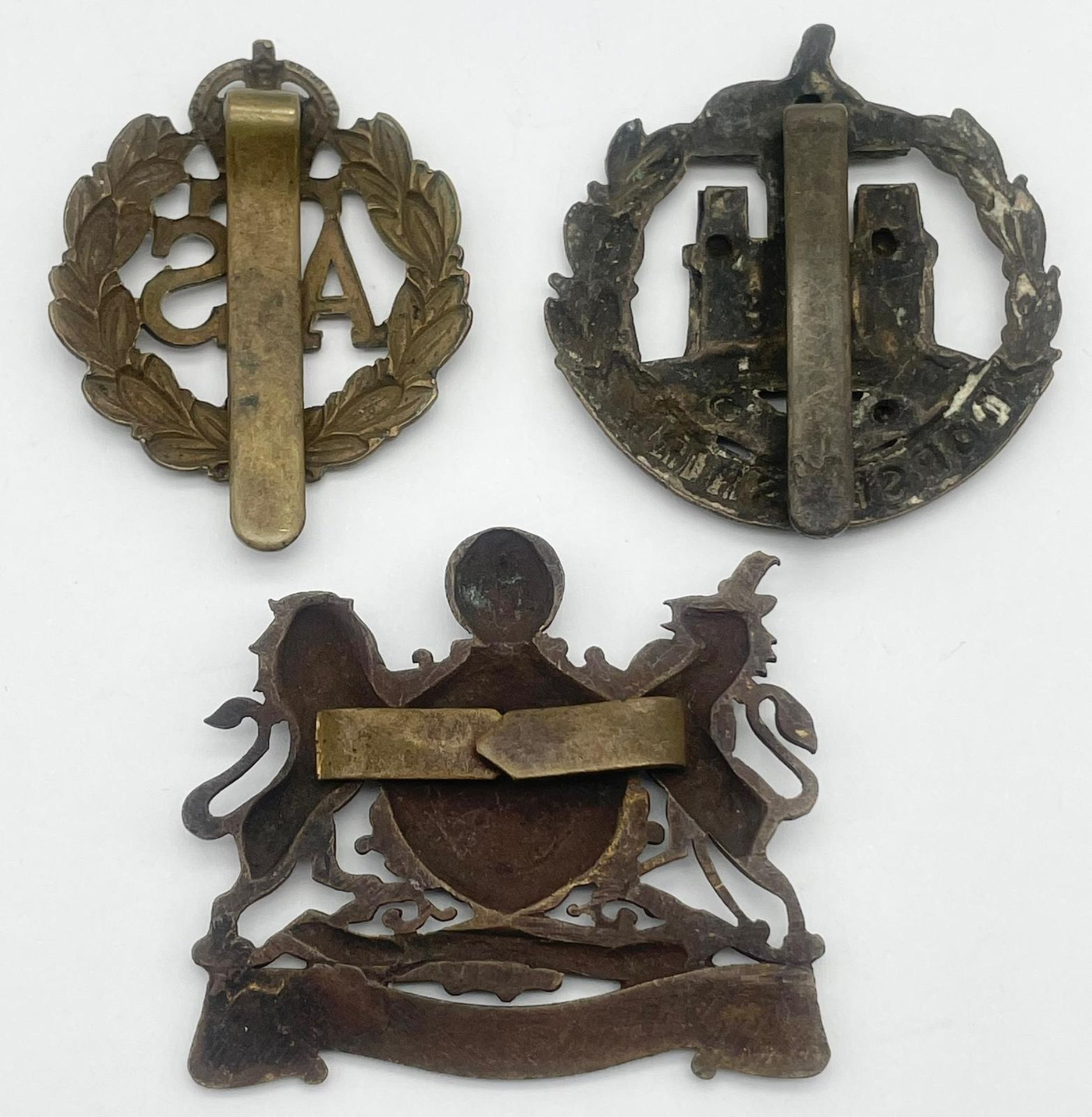 Three British Military Cap Badges: WW1 Dorsetshire Regiment Corp, WW2 Royal Artillery Manchester and - Image 3 of 6