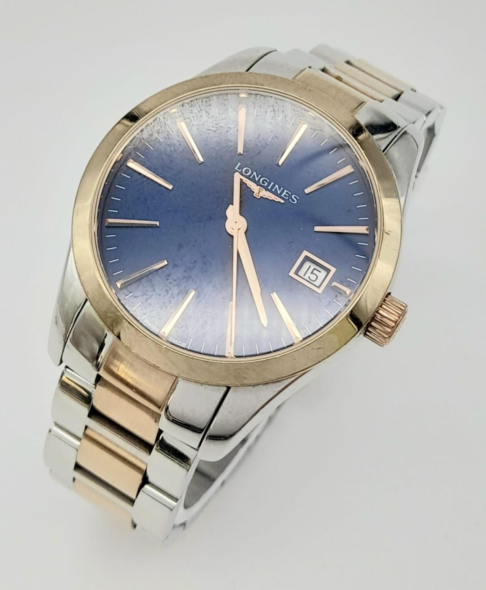 A Longines Conquest Classic Ladies Quartz Watch. Two-tone steel strap and case - 34mm. Midnight blue