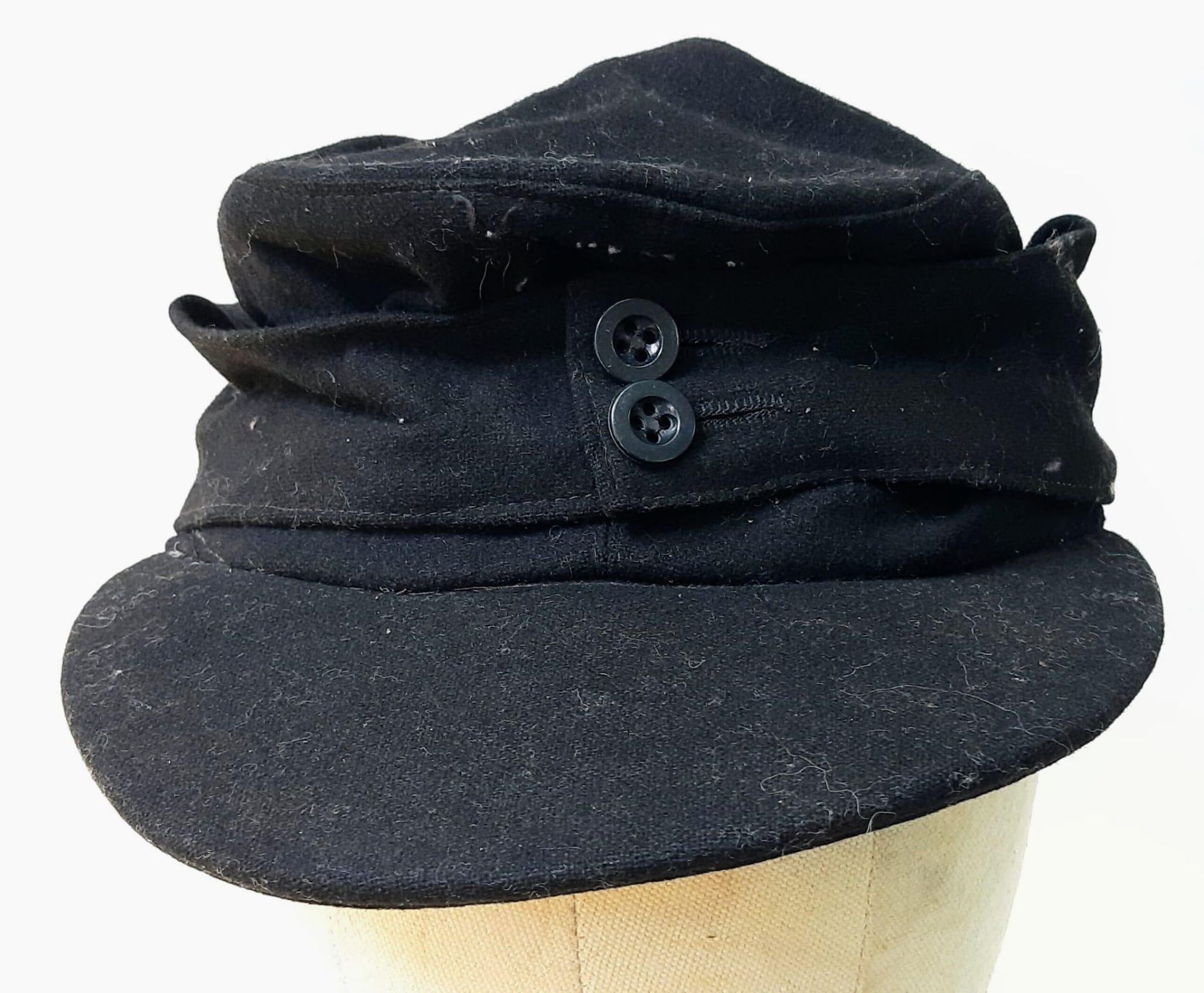 WW2 German M43 Panzer Side Cap. Black wool construction with removed insignia, (maybe P.O.W). The