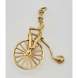 9K YELLOW GOLD PENNY FARTHING CHARM. 3.7G