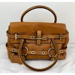 A Luella Brown Leather Handbag with Dust-Cover. Gold-tone furniture. Heart tassles. Exterior