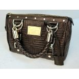 A Gianni Versace Couture Brown Leather Handbag. Gold-tone hardware. Cloth interior with zipped