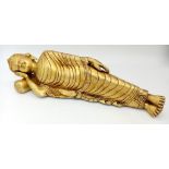 A Large Brass Reclining Buddha Figure with Head-Rest Pillow. 37cm length. 2.4k weight.