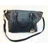 A Michael Kors Black Leather Hand/Shoulder Bag. Textured black leather. Gold-tone hardware. Black