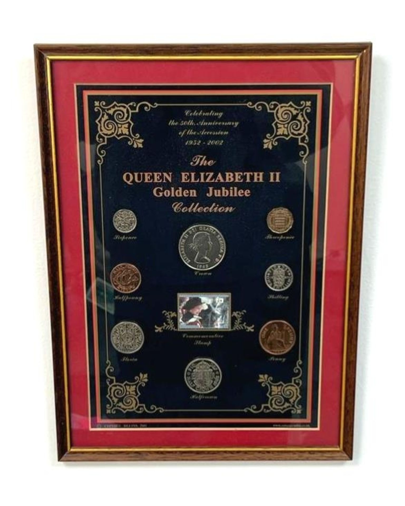 A Framed Queen Elizabeth II Golden Jubilee Coin Collection. Eight commemorative coins in total. In